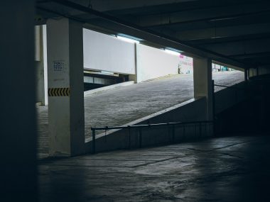 An empty parking garage with a ramp leading up to it