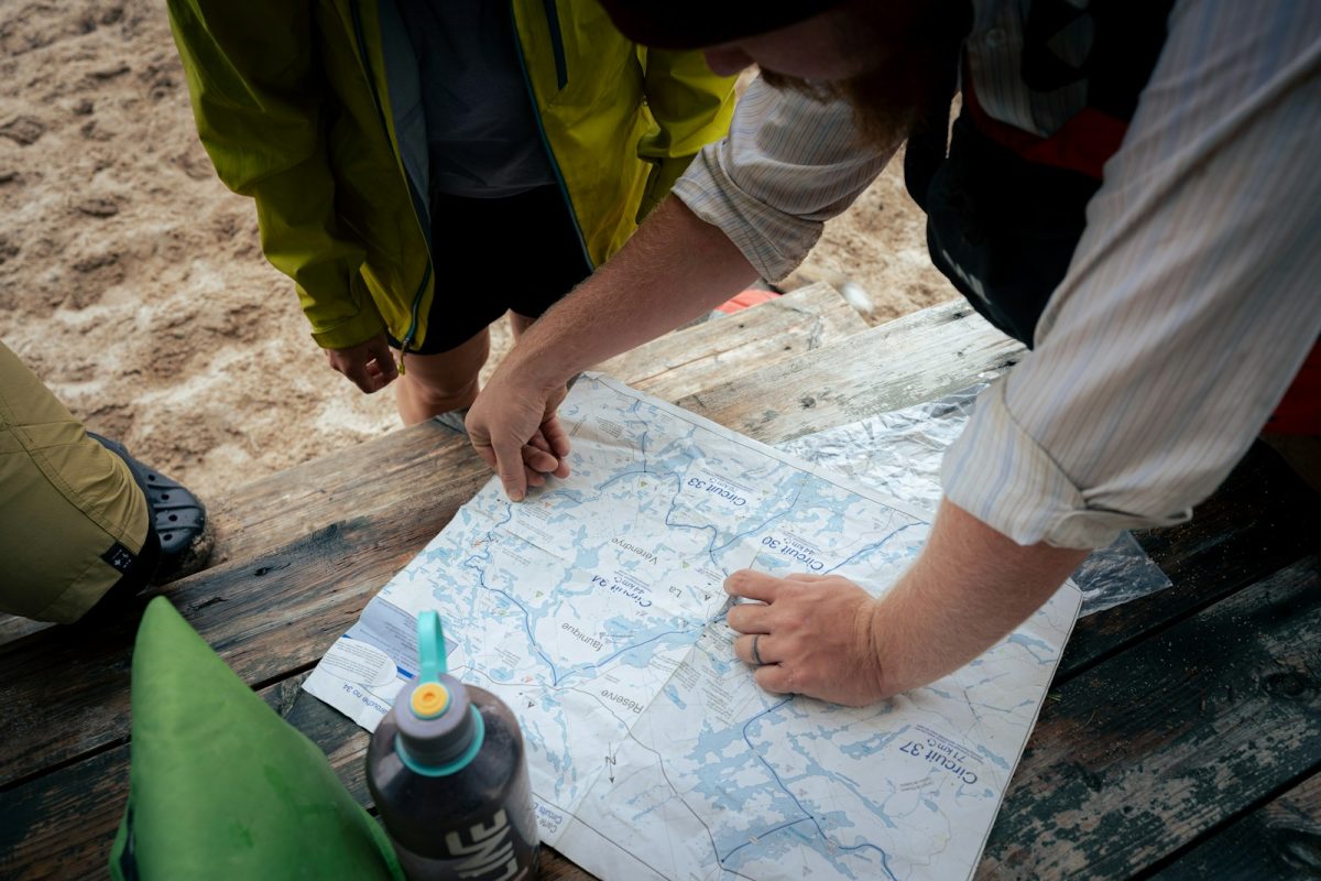 A group of people standing around a map