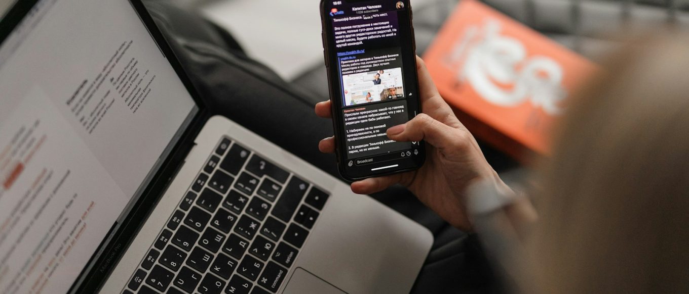 person holding black iphone 4