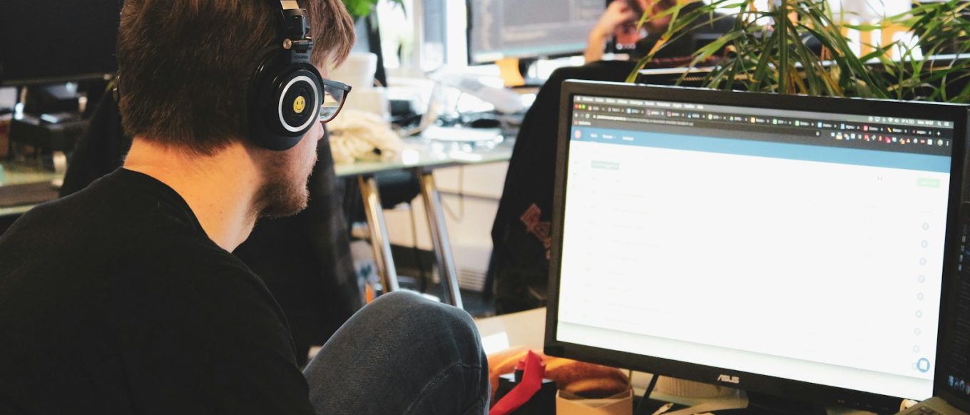 man in black shirt wearing black headphones